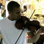 J. Cole playing violin